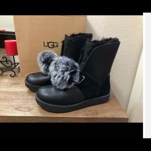 Ugg boots, leather with poms that can be removed.